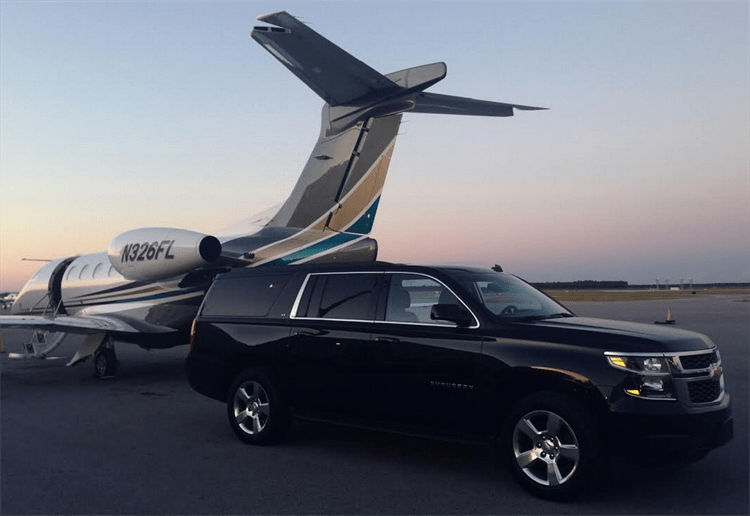Black luxury SUV with private jet - Premium transportation services